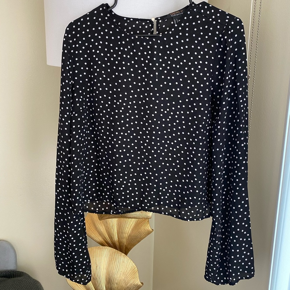 Polka dot long sleeve top.